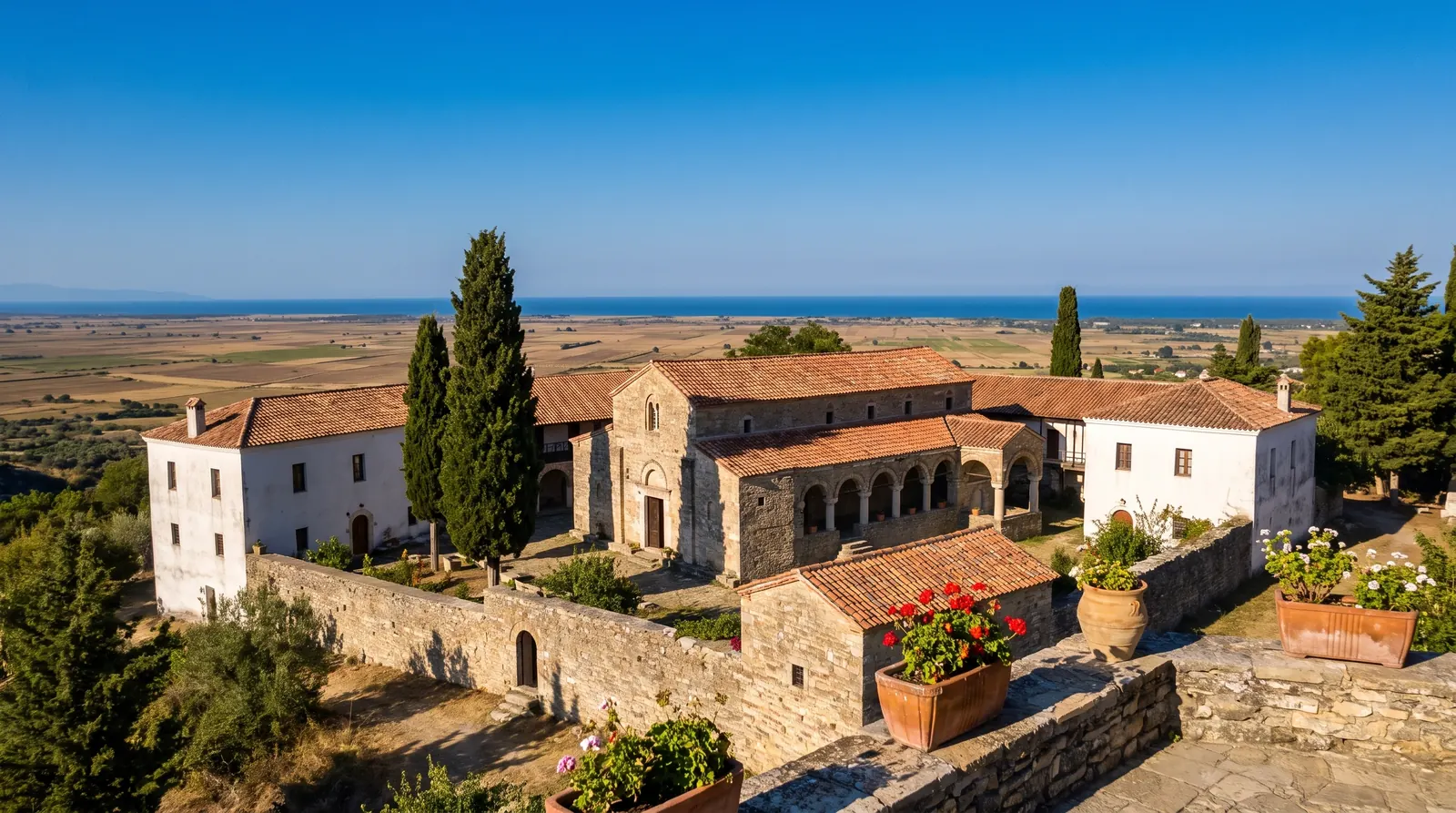 Ardenica's walled compound on its ridge, the Myzeqe plain beyond the wall