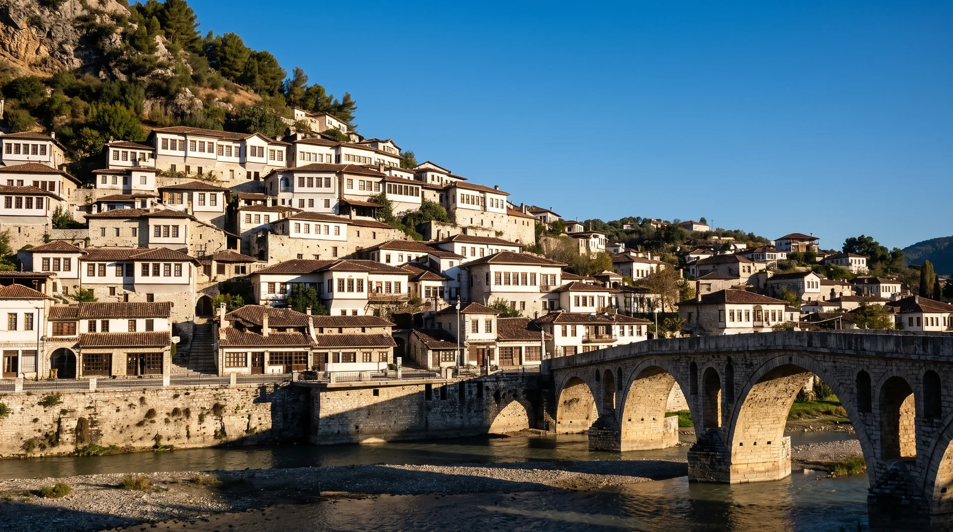 The stacked white Ottoman facades of Berat's Mangalem quarter rising above the Osum