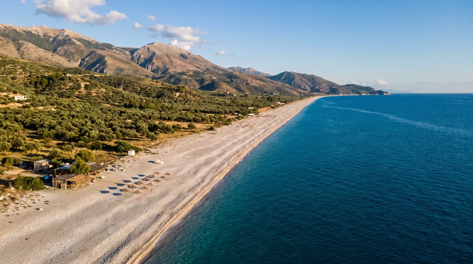 The seven-kilometre shingle shore at Borsh running away below the olive groves