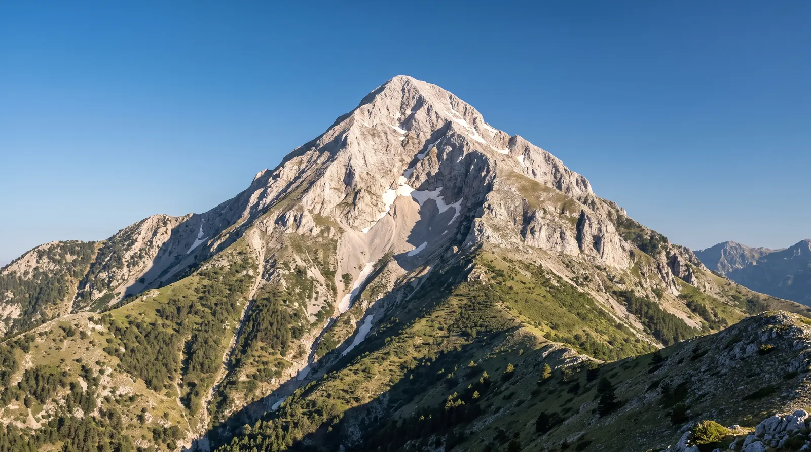 The limestone pyramid of Gjallica alone in clear morning light