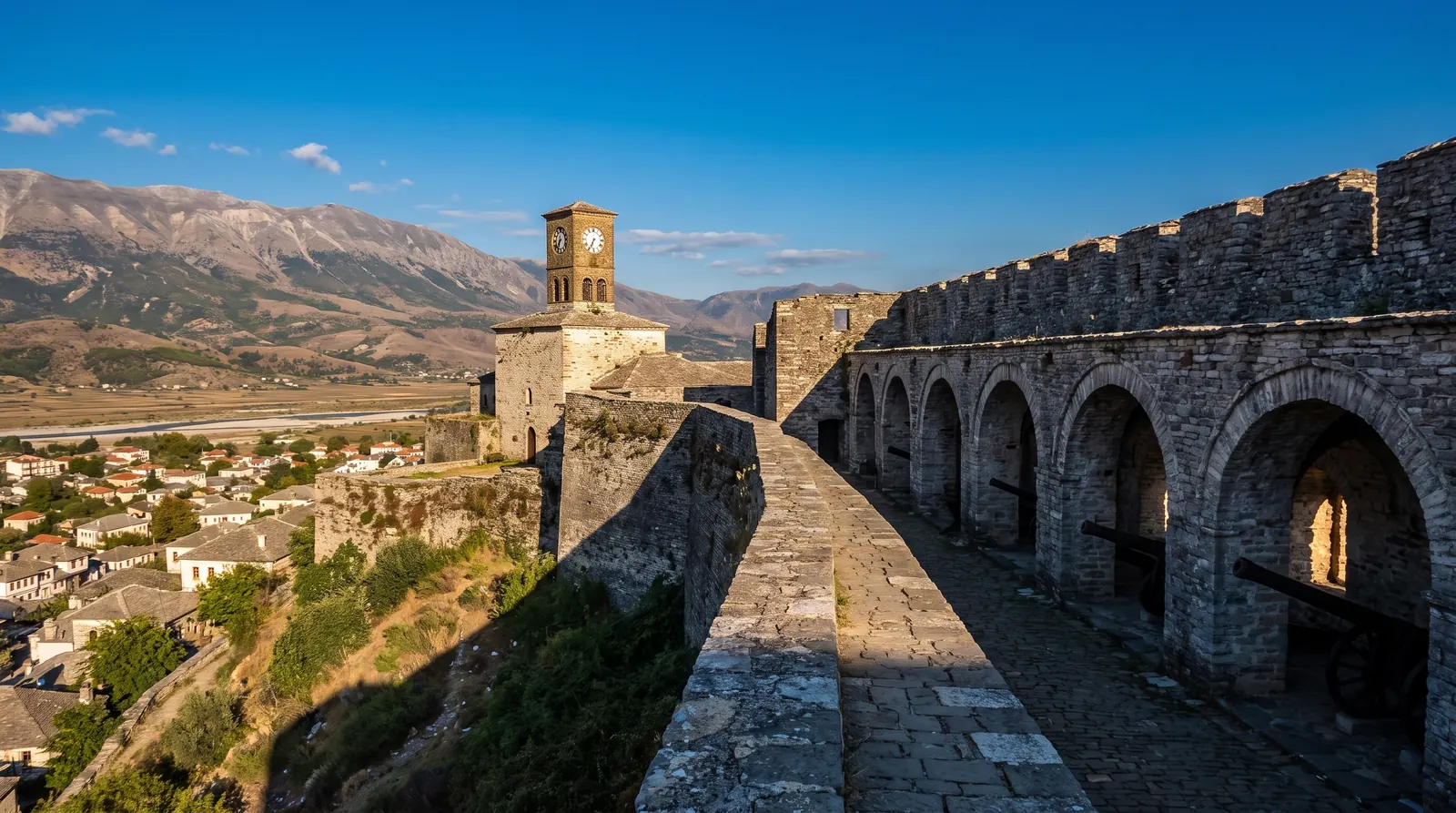 The ramparts and vaulted gun gallery of Gjirokaster castle above the Drino valley