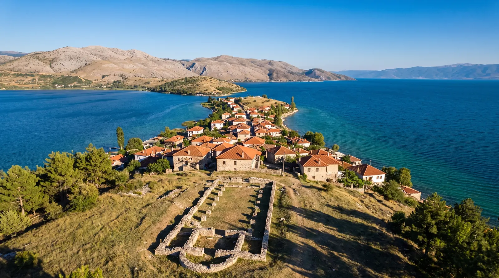 The village of Lin on its peninsula in Lake Ohrid, the basilica footings on the hill above