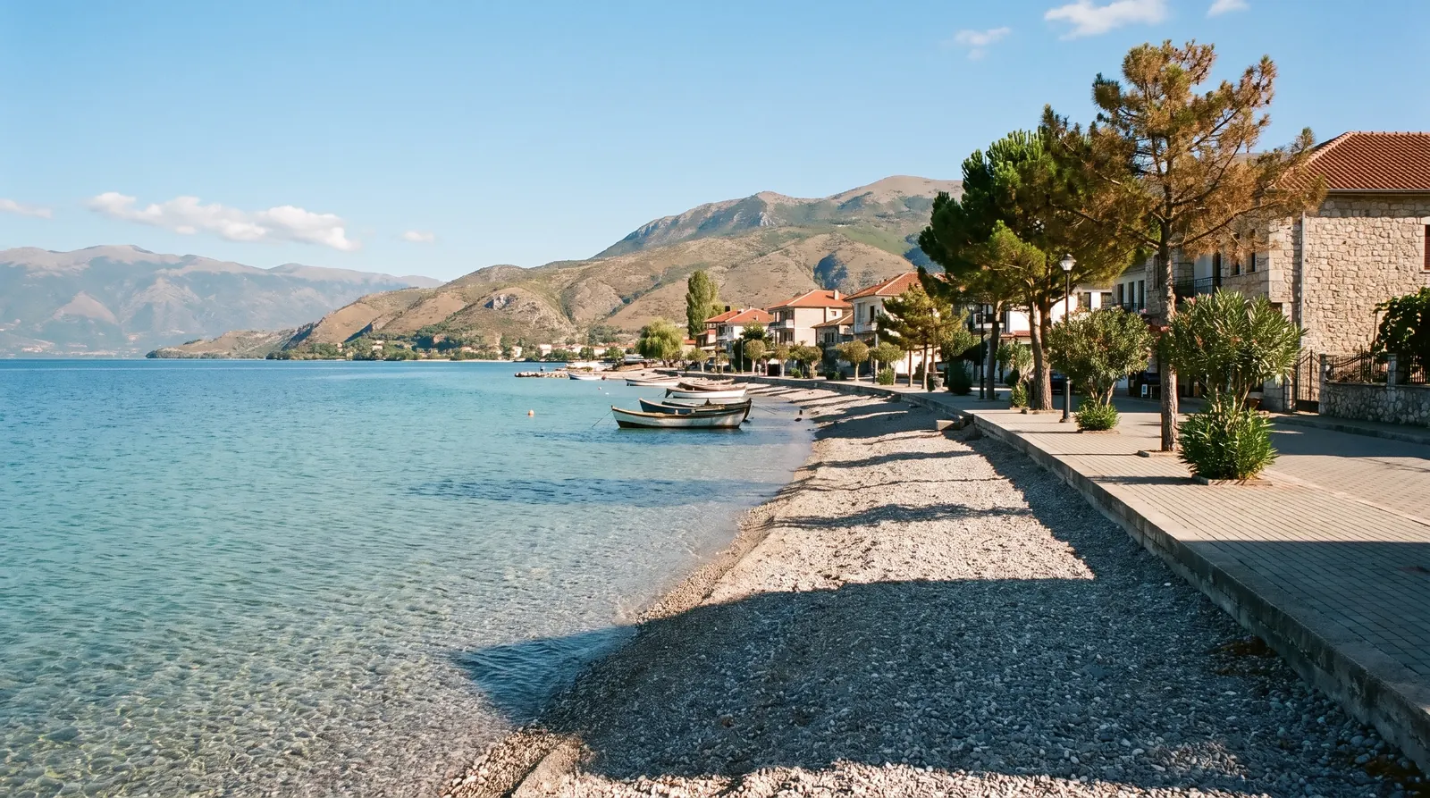 Pogradec's stony beach and promenade on the Albanian shore of Lake Ohrid