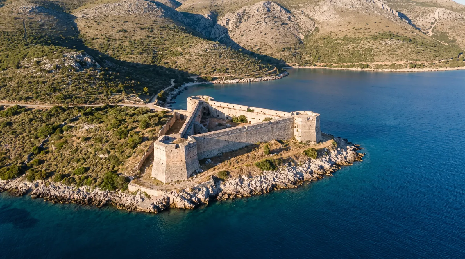 The triangular Ali Pasha fortress on its peninsula at Porto Palermo