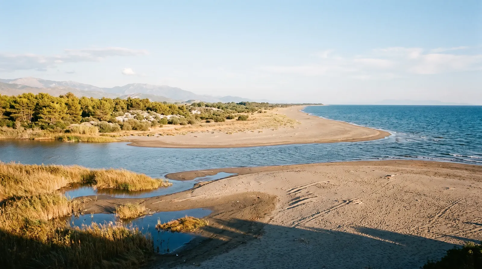 The Buna reaching the Adriatic at Velipoje, sand spit between river and sea